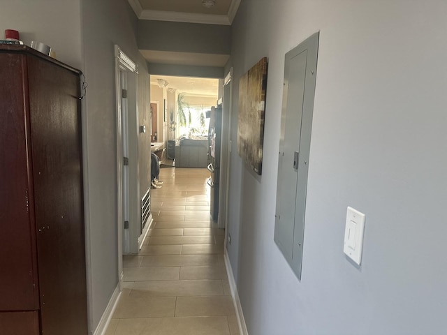 hall with electric panel, light tile patterned floors, baseboards, and ornamental molding