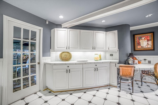 bar with recessed lighting, light floors, wainscoting, and tasteful backsplash