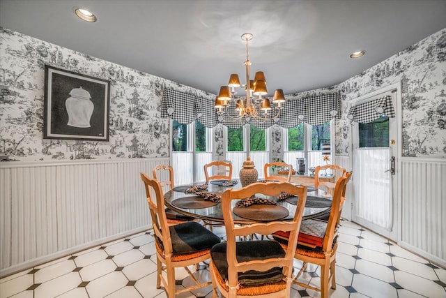 dining area featuring wainscoting, wallpapered walls, a notable chandelier, light floors, and recessed lighting