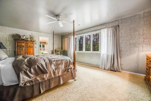 carpeted bedroom with baseboards, ceiling fan, and visible vents
