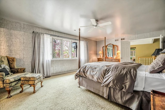 bedroom featuring visible vents, carpet flooring, and a ceiling fan