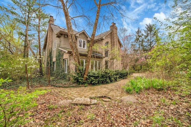 view of home's exterior featuring a chimney