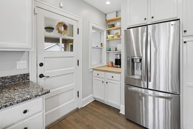 kitchen featuring open shelves, stainless steel refrigerator with ice dispenser, dark wood-type flooring, and white cabinets