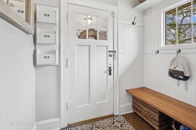 mudroom with baseboards and dark wood-style flooring