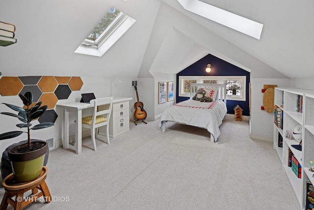 bedroom with baseboards, vaulted ceiling with skylight, and carpet
