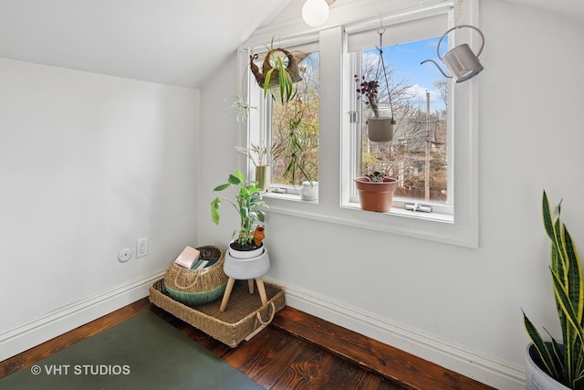sitting room featuring vaulted ceiling, wood finished floors, and baseboards
