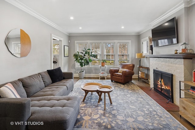 living room with recessed lighting, a wealth of natural light, crown molding, and a fireplace