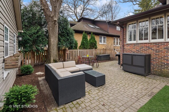 view of patio / terrace featuring a fenced backyard and an outdoor living space