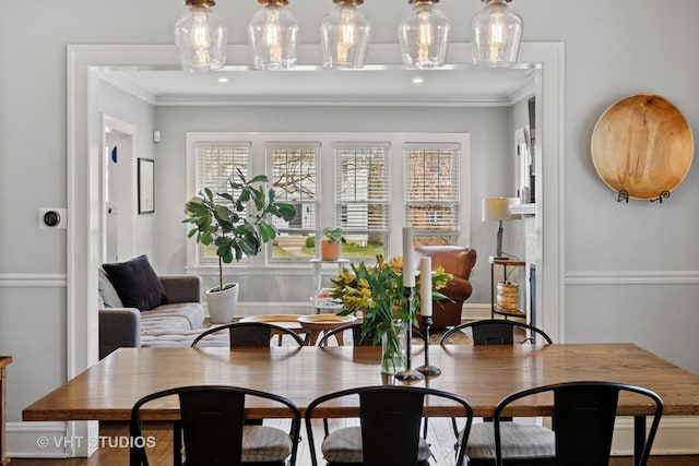 dining area featuring crown molding