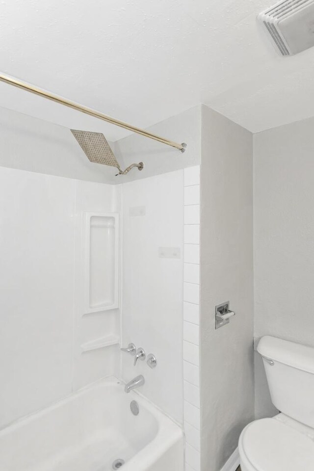 full bathroom with visible vents, shower / bathing tub combination, and toilet