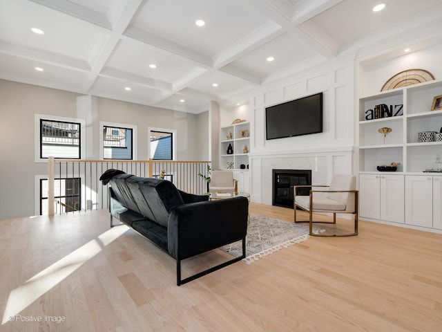 living area featuring recessed lighting, light wood-type flooring, beam ceiling, and coffered ceiling