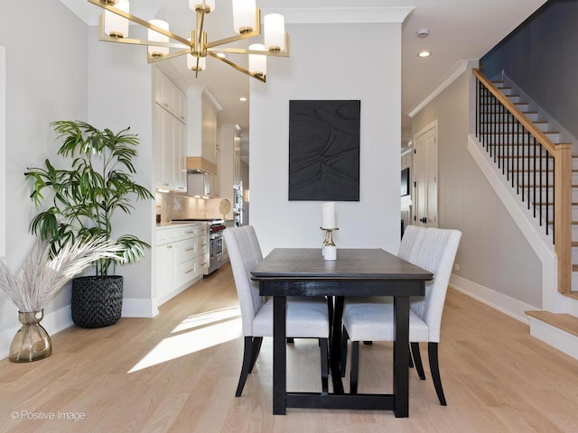 dining space featuring crown molding, an inviting chandelier, light wood-style flooring, recessed lighting, and stairway