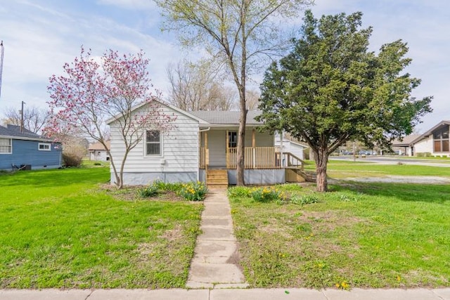 bungalow-style house featuring a front lawn and covered porch