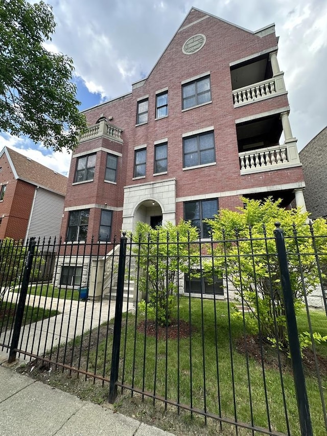 3862 S Lake Park Ave Unit 3S, Chicago, IL 60653 - view of front of property featuring a fenced front yard and brick siding