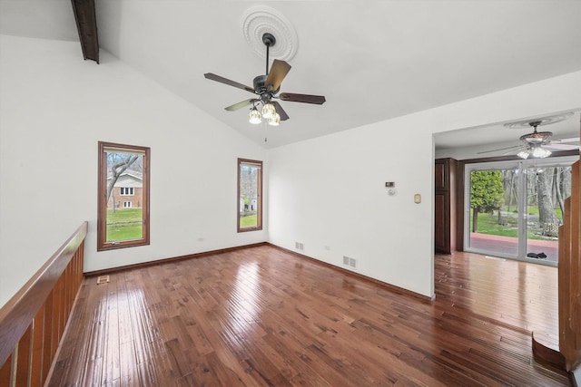 unfurnished living room with visible vents, ceiling fan, beam ceiling, and hardwood / wood-style flooring