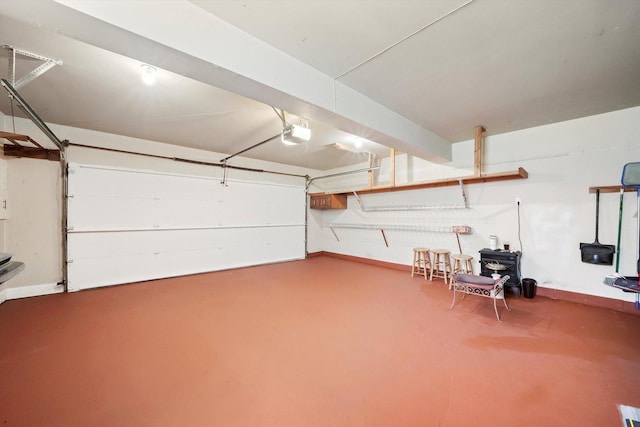 garage featuring baseboards and a garage door opener