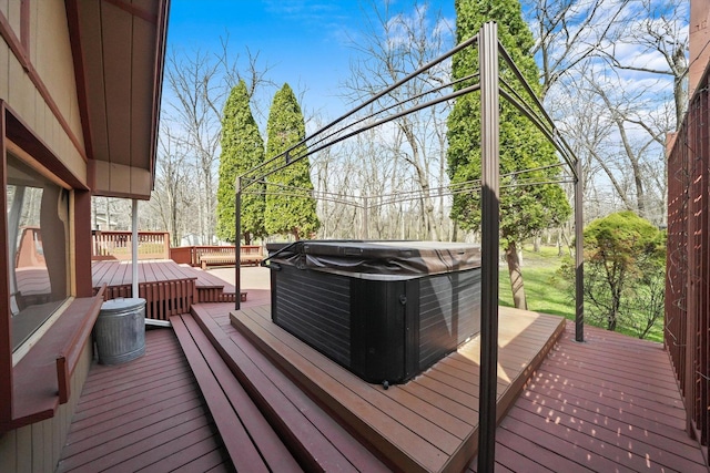 wooden terrace with a hot tub