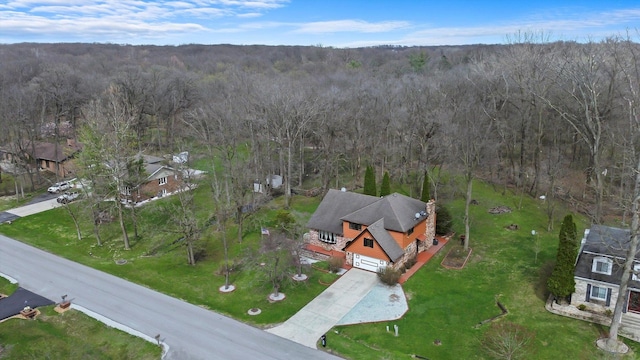 drone / aerial view featuring a view of trees