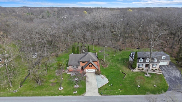bird's eye view featuring a wooded view