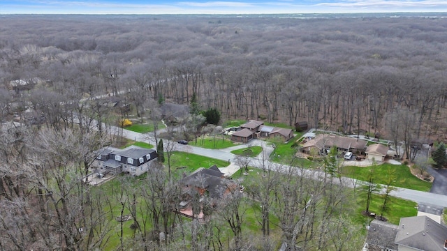 birds eye view of property with a wooded view and a residential view