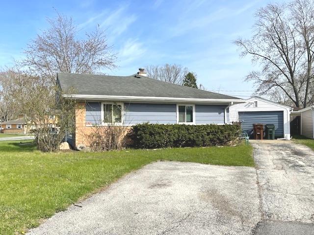 275 Blackhawk Dr, Park Forest, IL 60466 - ranch-style house with a front lawn, driveway, an attached garage, and a chimney