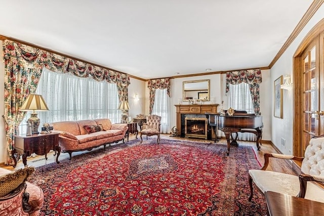 living room with crown molding, a wealth of natural light, a premium fireplace, and baseboards
