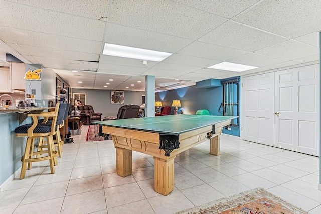 playroom featuring light tile patterned floors and a drop ceiling