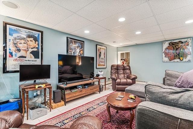 living area with recessed lighting, a paneled ceiling, tile patterned flooring, and baseboard heating
