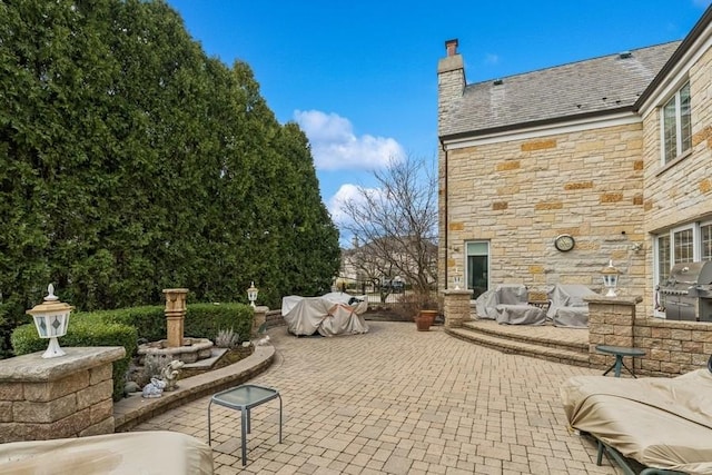 view of patio / terrace featuring an outdoor kitchen and area for grilling