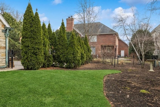 view of yard featuring fence and a gate