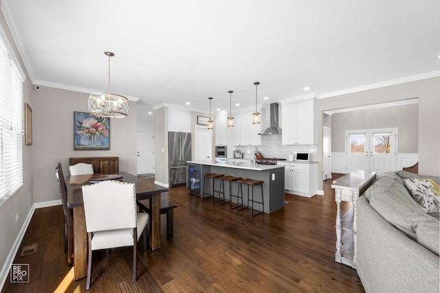 dining area featuring visible vents, an inviting chandelier, ornamental molding, dark wood finished floors, and recessed lighting