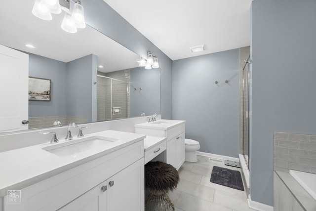 bathroom featuring a shower stall, tile patterned floors, two vanities, and a sink