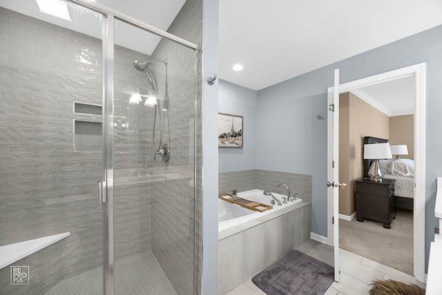 full bath featuring a shower stall, ensuite bath, a bath, and baseboards