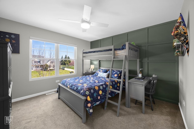 carpeted bedroom with baseboards and a ceiling fan