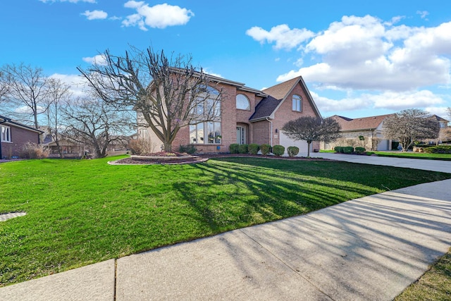 14232 Selva Ln, Orland Park, IL 60462 - traditional-style house with a front lawn, brick siding, and driveway