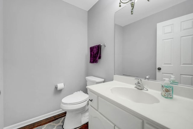 14232 Selva Ln, Orland Park, IL 60462 - half bath featuring toilet, vanity, baseboards, and wood finished floors