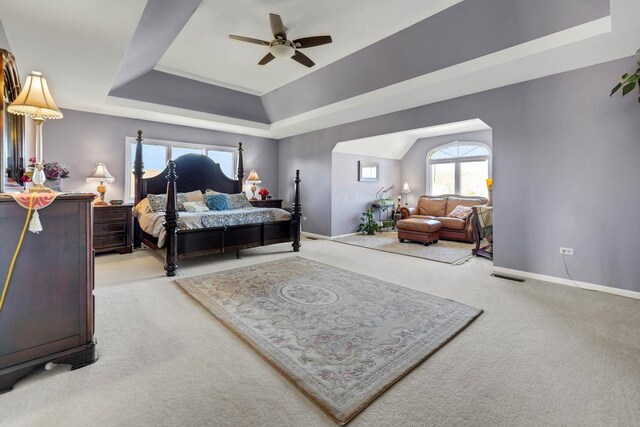14232 Selva Ln, Orland Park, IL 60462 - bedroom with carpet floors, a tray ceiling, baseboards, and ceiling fan