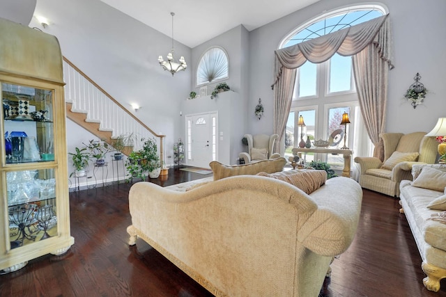 14232 Selva Ln, Orland Park, IL 60462 - living area with a chandelier, a high ceiling, dark wood-type flooring, and stairs