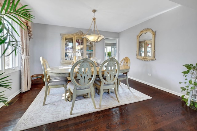 14232 Selva Ln, Orland Park, IL 60462 - dining room featuring baseboards and wood finished floors