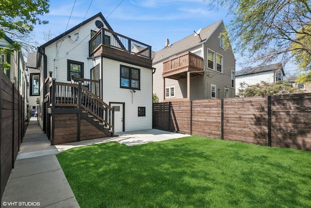 view of yard with a fenced backyard and stairs