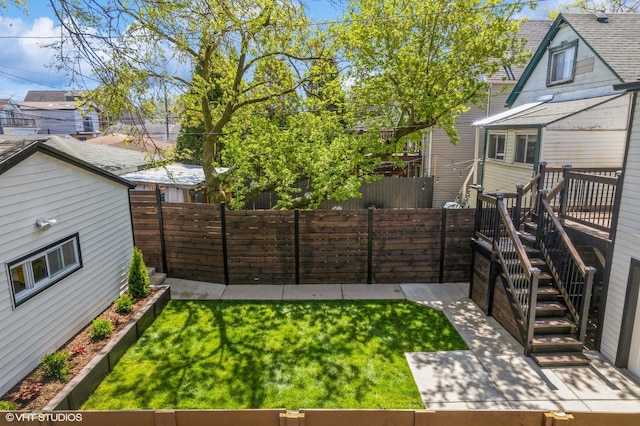 view of yard with a fenced backyard and a patio area