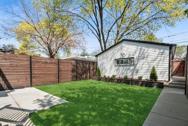 back of property featuring a patio, a fenced backyard, a yard, and a balcony
