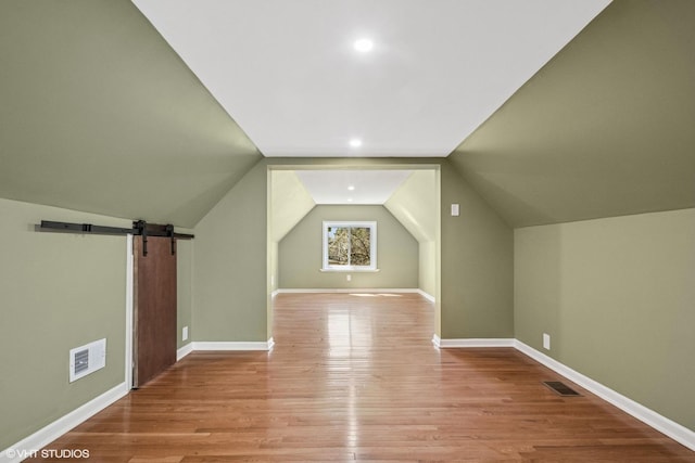 interior space with baseboards and light wood-style flooring