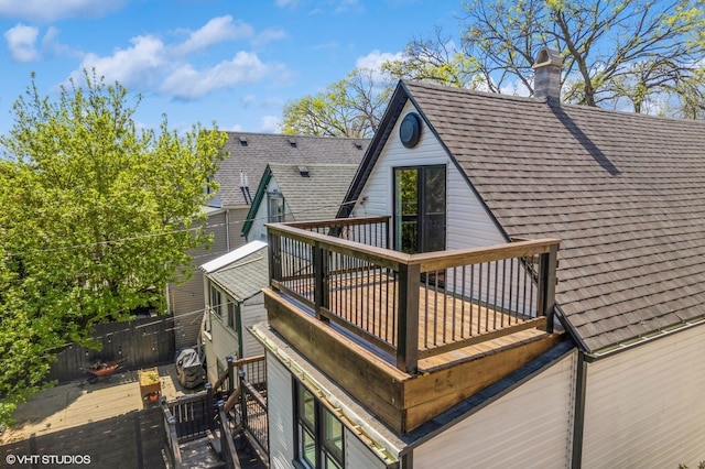 wooden terrace featuring fence