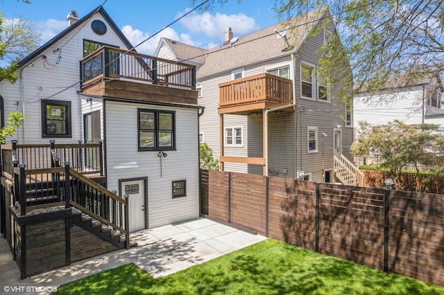 view of yard with a fenced backyard and stairs