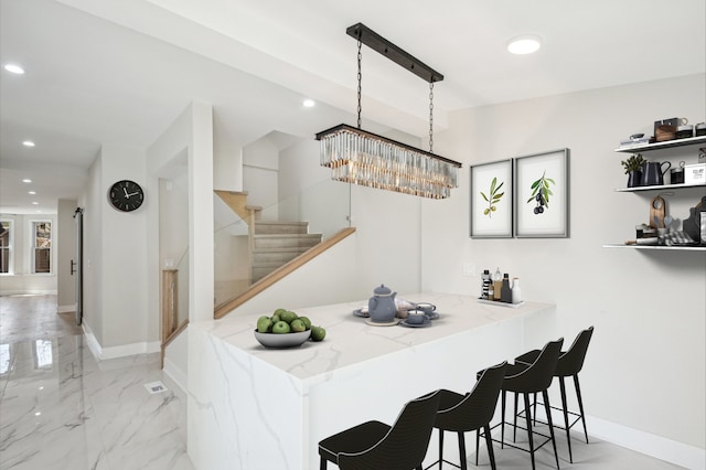 stairway with recessed lighting and marble finish floor