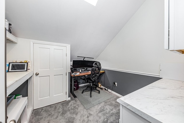 carpeted home office featuring baseboards