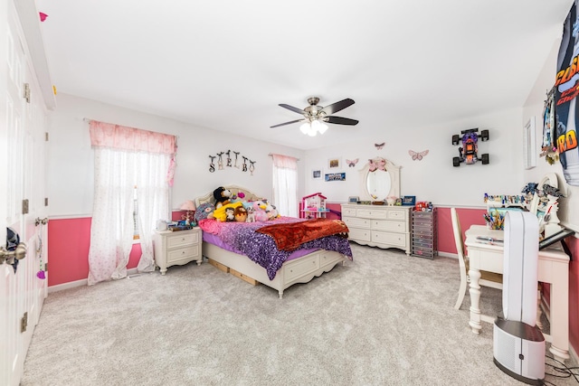bedroom featuring baseboards, a ceiling fan, and carpet