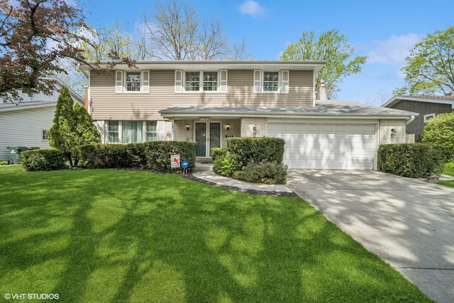 1704 Executive Ln, Glenview, IL 60026 - traditional-style home featuring concrete driveway, a front lawn, an attached garage, and brick siding