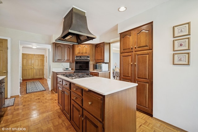 1704 Executive Ln, Glenview, IL 60026 - kitchen with island exhaust hood, baseboards, and light countertops